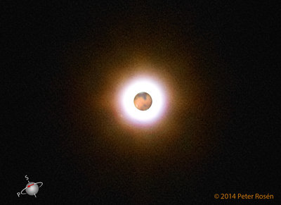 Phobos is seen to the left of Mars