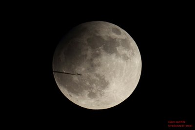 Partial eclipse with aircraft.jpg