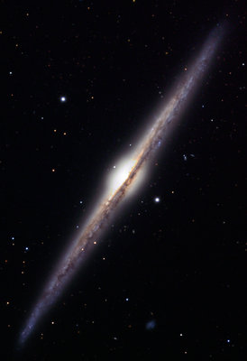NGC 4565, an edge-on spiral galaxy. The stars, dust <br />and gas are concentrated into a thin disc, much like the <br />one in our Milky Way galaxy. (Credit: Jschulman555)