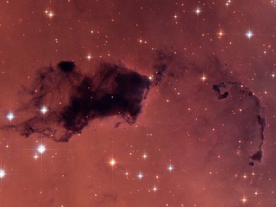 This Hubble image features dark knots of gas and dust known as &quot;Bok <br />globules,&quot; which are dense pockets in larger molecular clouds. Similar <br />islands of material in the early universe could have held as much water <br />vapor as we find in our galaxy today, despite containing a thousand times <br />less oxygen.  (Credit: NASA, ESA, Hubble Heritage (STScI/AURA))
