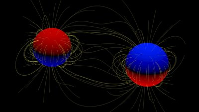 A cartoon of the two giant stars in the binary system. The polarity of the star's <br />surface magnetic field, north or south, is indicated by red and blue respectively. <br />Yellow lines indicate the magnetic field lines running from the stellar surfaces. <br />Credit: Visualisation courtesy of Volkmar Holzwarth, KIS, Freiburg.