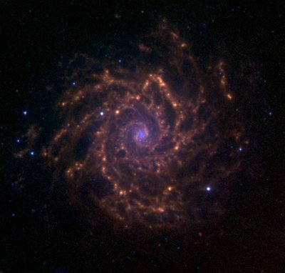 M74 as observed with the Spitzer Space Telescope as part of the <br />Spitzer Infrared Nearby Galaxy Survey. The blue colors represent <br />the 3.6 micrometre emission from stars. The green and red colors <br />represent the 5.8 and 8.0 micrometre emission from polycyclic <br />aromatic hydrocarbons and possibly dust.