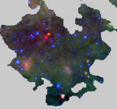 An image of a region with both star-forming cores (seen in the red) and <br />starless clumps (the dark regions). Astronomers have combined statistical <br />studies of these infrared data with submillimeter images to estimate the <br />typical age of a massive star forming clump as about one million years. <br />The red data are from Herschel 70 micron images, the green and blue are <br />from Spitzer IRAC images at 8 and 4.5 microns. (Battersby et al, ApJ, 2017)