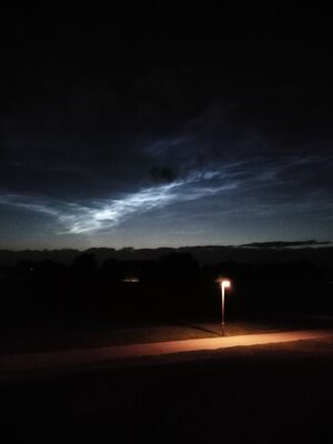 Noctilucent clouds with dark clouds like letters July 5 2020.jpg