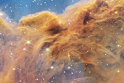 background galaxy in carina nebula dust.JPG