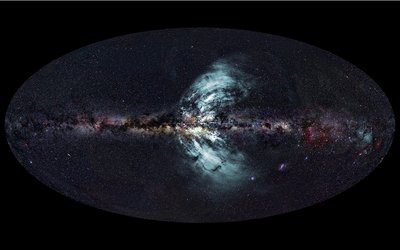 The new-found outflows of particles (pale blue) from the Galactic Centre. The <br />background image is the whole Milky Way at the same scale. The curvature of <br />the outflows is real, not a distortion caused by the imaging process. <br /><br />Credits: Axel Mellinger, Central Michigan Univ (optical image); <br />Ettore Carretti, CSIRO (radio image); S-PASS survey team (radio data); <br />Eli Bressert, CSIRO (composition).