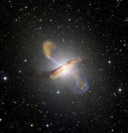 Colour composite image of Centaurus A, revealing the lobes and jets emanating from the active galaxy’s central black hole. ESO