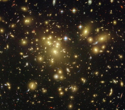 A1689-zD1, one of the brightest and most distant galaxies, <br />is 12.8 billion light years away - an extremely far distance <br />in our expanding universe.<br />(Credit: NASA/ESA/JPL-Caltech/STScI)