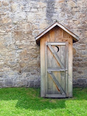 rustic-outhouse-front-vintage-stone-wall-19772104.jpg