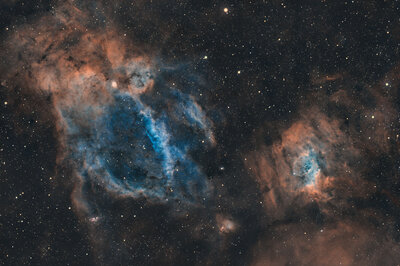 The Lobster Claw Nebula reaches for the Bubble Nebula